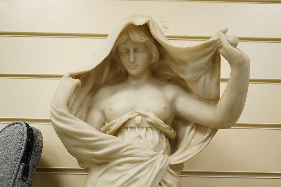 A large simulated marble statuette of a semi nude female, 73cm high